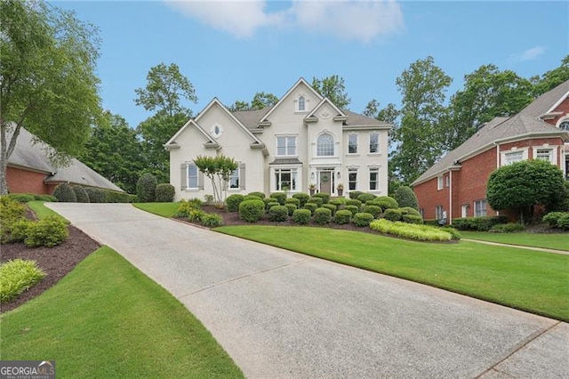 view of front of house featuring a front yard and stucco siding