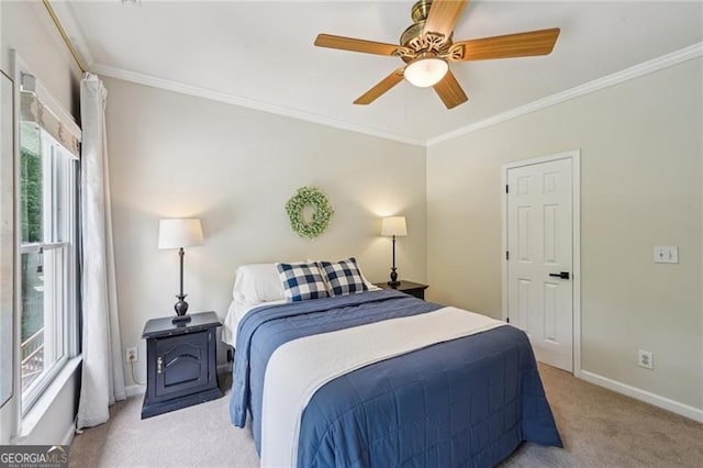 bedroom featuring light carpet, baseboards, crown molding, and a ceiling fan