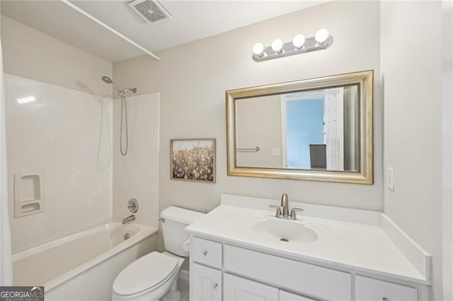 bathroom with toilet, vanity, and washtub / shower combination