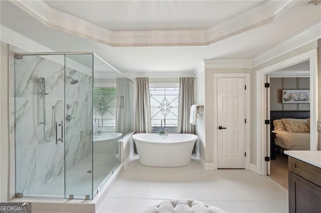 ensuite bathroom featuring a freestanding bath, crown molding, a marble finish shower, a tray ceiling, and tile patterned flooring