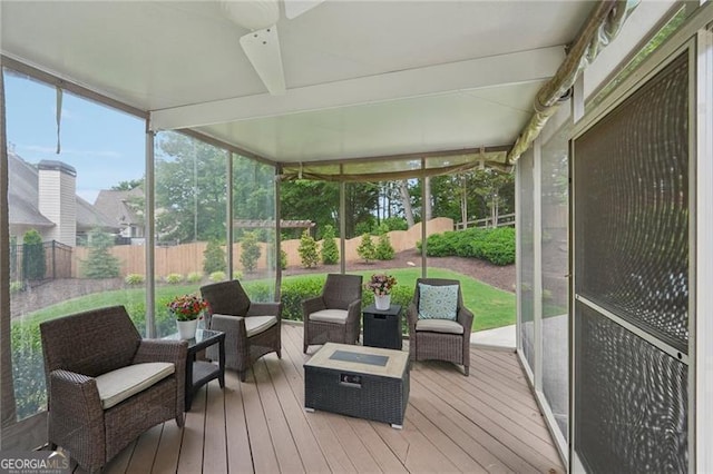 sunroom featuring outdoor lounge area