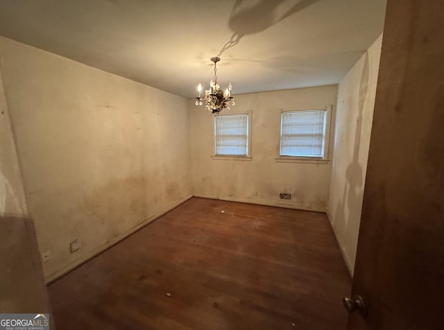 4720 Ben Hill Rd, South Fulton, GA 30349 - unfurnished room with wood finished floors and a chandelier