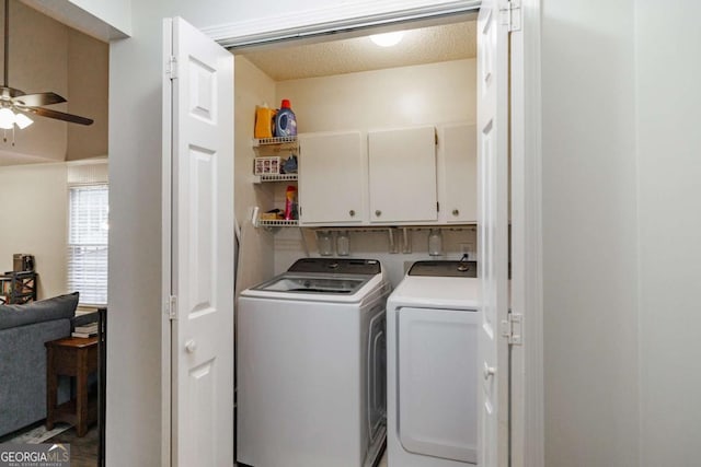 clothes washing area with cabinet space, washer and dryer, ceiling fan, and a textured ceiling