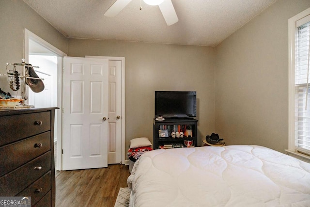 bedroom featuring wood finished floors and ceiling fan