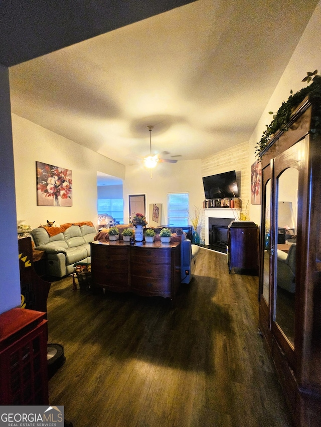 395 Brooks Village Dr, Pendergrass, GA 30567 - living room with wood finished floors, a fireplace, and a ceiling fan