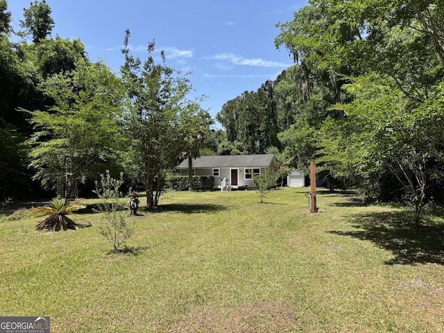 13327 US Highway 17, Woodbine, GA 31569 - view of grassy yard with a garage
