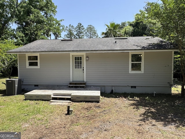 13327 US Highway 17, Woodbine, GA 31569 - back of house with crawl space, a shingled roof, and a lawn