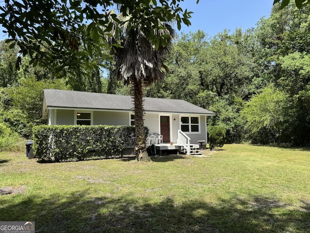 13327 US Highway 17, Woodbine, GA 31569 - view of front of property with a front lawn and roof with shingles