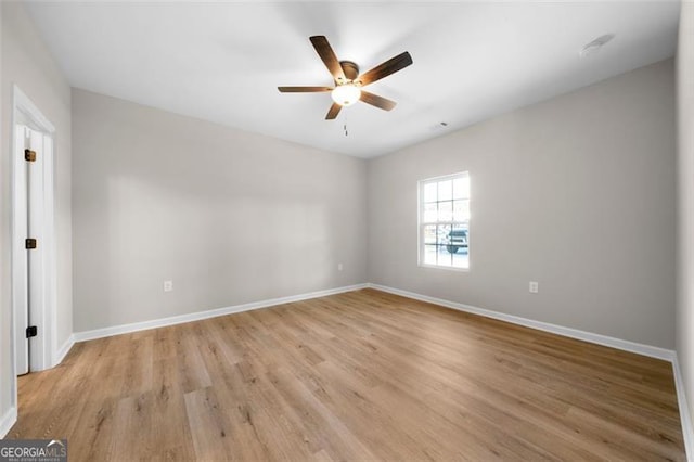 389 Campground School Rd, Dallas, GA 30157 - unfurnished room with a ceiling fan, baseboards, and light wood-style flooring