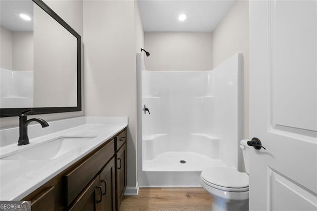 389 Campground School Rd, Dallas, GA 30157 - full bathroom featuring wood finished floors, a shower, toilet, and vanity