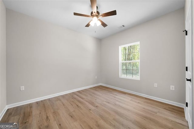 389 Campground School Rd, Dallas, GA 30157 - unfurnished room featuring wood finished floors, a ceiling fan, and baseboards