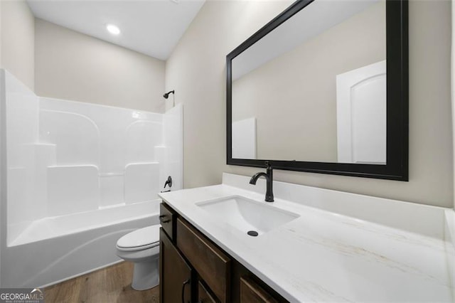 389 Campground School Rd, Dallas, GA 30157 - full bathroom with wood finished floors, toilet, vanity, and bathing tub / shower combination