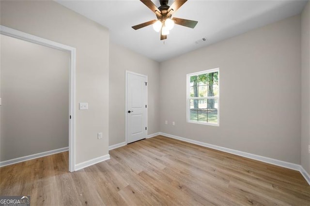 389 Campground School Rd, Dallas, GA 30157 - unfurnished bedroom with light wood-style flooring, baseboards, and a ceiling fan