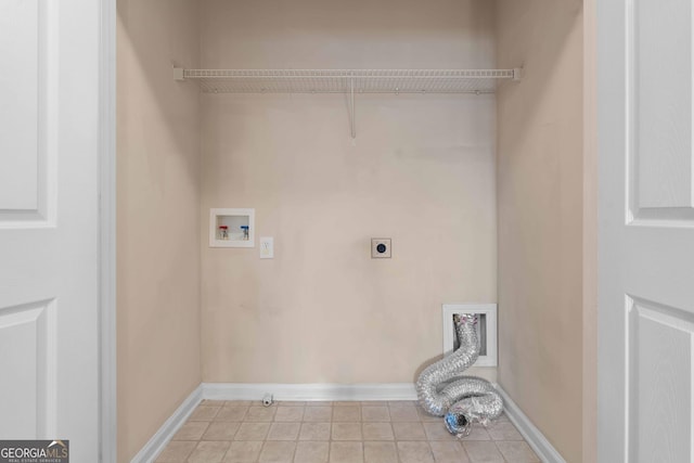 laundry area featuring electric dryer hookup, washer hookup, light tile patterned flooring, and baseboards