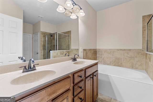 full bath featuring a stall shower, a garden tub, and double vanity