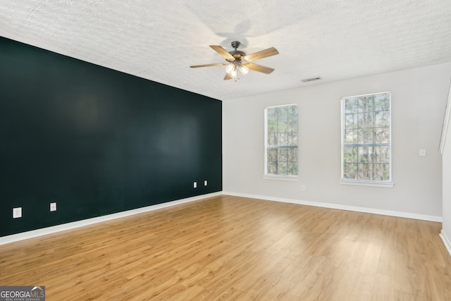 103 Timber Ridge Dr, Cartersville, GA 30121 - unfurnished room with wood finished floors, ceiling fan, baseboards, and a textured ceiling