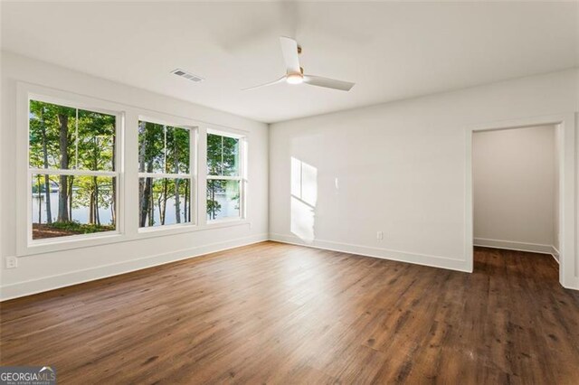 1161 Open Water Dr, Greensboro, GA 30642 - spare room with baseboards, ceiling fan, and wood finished floors