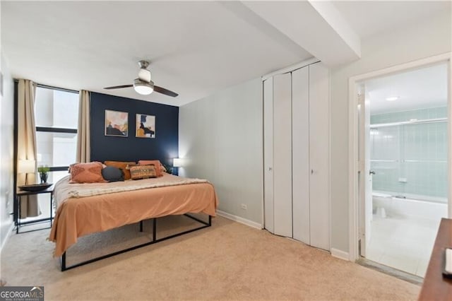 620 Peachtree St NE Unit 403, Atlanta, GA 30308 - bedroom featuring carpet flooring, baseboards, ensuite bathroom, and ceiling fan