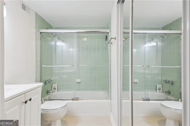 620 Peachtree St NE Unit 403, Atlanta, GA 30308 - full bath with toilet, tile patterned floors, enclosed tub / shower combo, and vanity