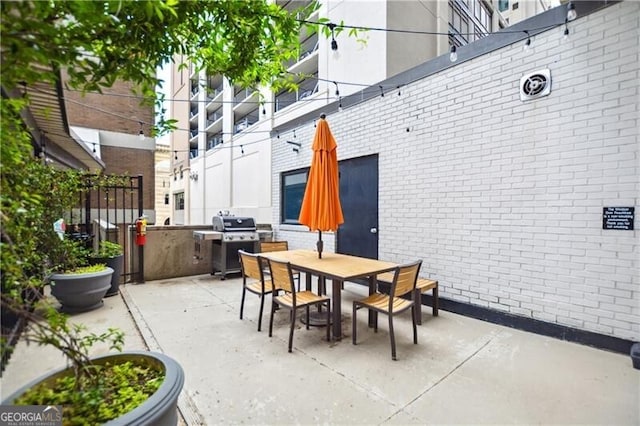 620 Peachtree St NE Unit 403, Atlanta, GA 30308 - view of patio / terrace with area for grilling, outdoor dining space, and exterior kitchen