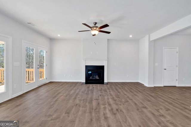 16 Grove Pointe Way SE, Cartersville, GA 30120 - unfurnished living room with a ceiling fan, wood finished floors, a fireplace with flush hearth, recessed lighting, and baseboards