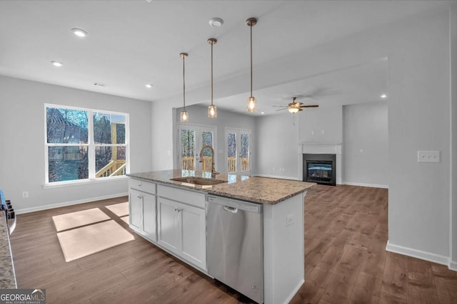 16 Grove Pointe Way SE, Cartersville, GA 30120 - kitchen featuring dishwasher, a sink, white cabinets, light stone countertops, and hanging light fixtures