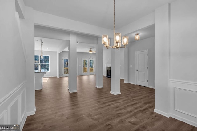 16 Grove Pointe Way SE, Cartersville, GA 30120 - unfurnished dining area with a chandelier, a ceiling fan, dark wood-style floors, and a fireplace