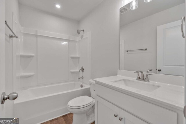 16 Grove Pointe Way SE, Cartersville, GA 30120 - bathroom with wood finished floors, toilet, vanity, bathing tub / shower combination, and recessed lighting