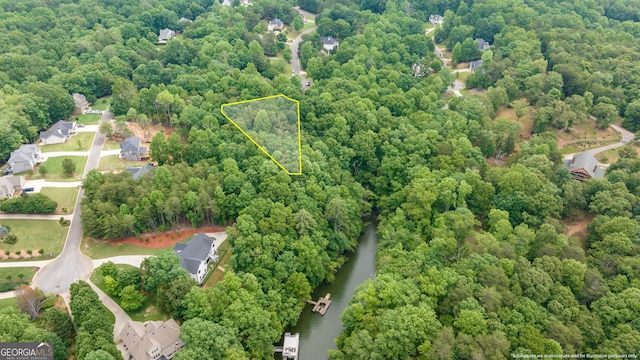 6126 Foxmoor Ct, Gainesville, GA 30506 - aerial view of property and surrounding area with property boundaries highlighted, a heavily wooded area, and a nearby body of water