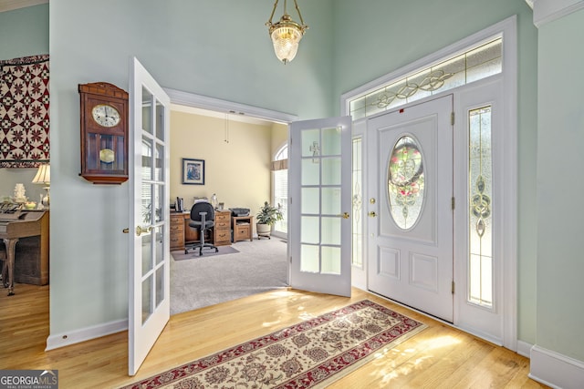 6126 Foxmoor Ct, Gainesville, GA 30506 - foyer featuring french doors, wood finished floors, baseboards, and a towering ceiling