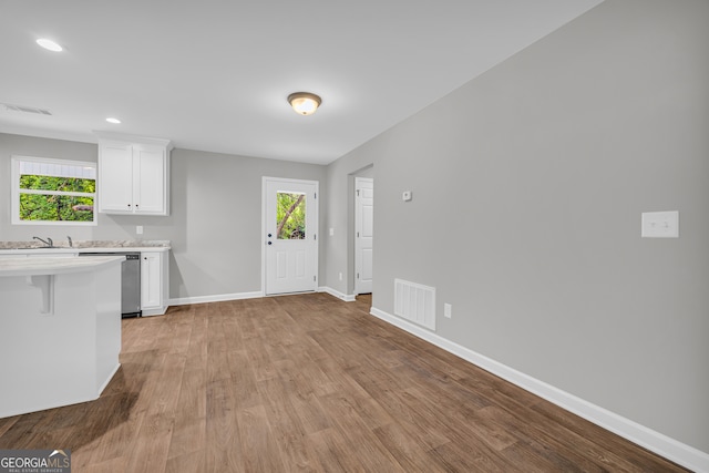 350 Maple St, Hartwell, GA 30643 - kitchen with light countertops, dishwasher, white cabinetry, plenty of natural light, and recessed lighting