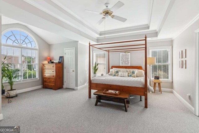 1316 Wind Chime Ct, Lawrenceville, GA 30045 - carpeted bedroom featuring baseboards, ornamental molding, a raised ceiling, and ceiling fan