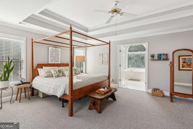 1316 Wind Chime Ct, Lawrenceville, GA 30045 - carpeted bedroom featuring a raised ceiling, ornamental molding, baseboards, and ensuite bathroom