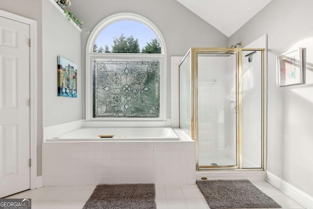 1316 Wind Chime Ct, Lawrenceville, GA 30045 - bathroom featuring a stall shower, a garden tub, vaulted ceiling, and tile patterned flooring
