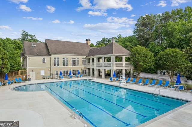 1316 Wind Chime Ct, Lawrenceville, GA 30045 - community pool with fence and a patio area