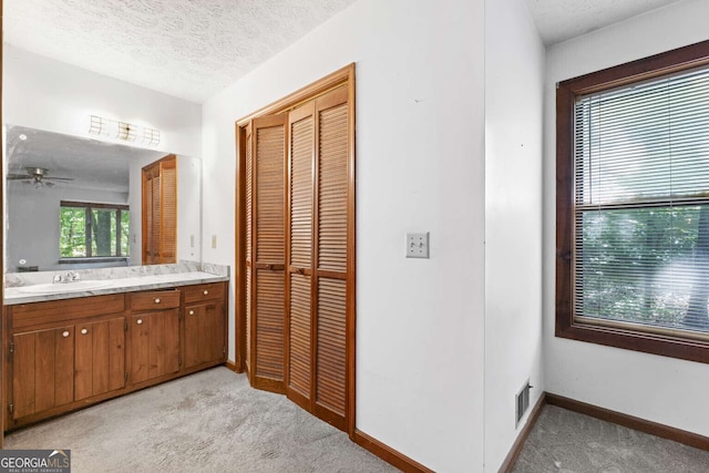1909 Winding Creek Ln SW, Marietta, GA 30064 - bathroom featuring vanity, baseboards, a textured ceiling, and ceiling fan