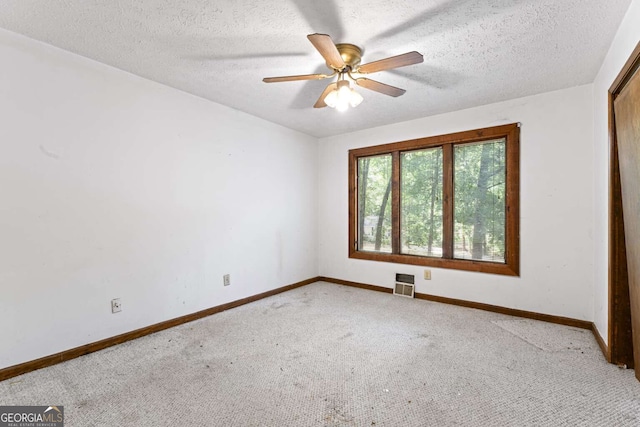 1909 Winding Creek Ln SW, Marietta, GA 30064 - empty room with carpet floors, baseboards, ceiling fan, and a textured ceiling