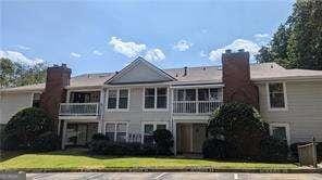 1371 Keys Lake Dr NE, Atlanta, GA 30319 - view of front of property featuring a chimney and a balcony