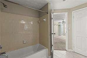 1371 Keys Lake Dr NE, Atlanta, GA 30319 - bathroom featuring bathing tub / shower combination