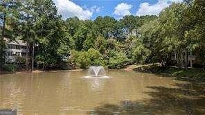 1371 Keys Lake Dr NE, Atlanta, GA 30319 - water view with a forest