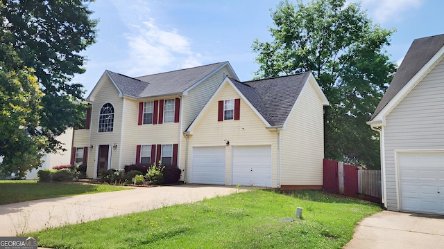 130 Hazelhurst Dr, Covington, GA 30016 - view of front of home featuring concrete driveway, a garage, and a shingled roof