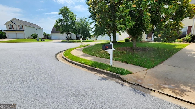 130 Hazelhurst Dr, Covington, GA 30016 - view of asphalt street featuring sidewalks, curbs, and a residential view