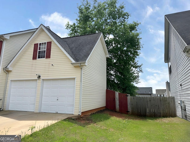 130 Hazelhurst Dr, Covington, GA 30016 - view of side of property featuring roof with shingles and a garage