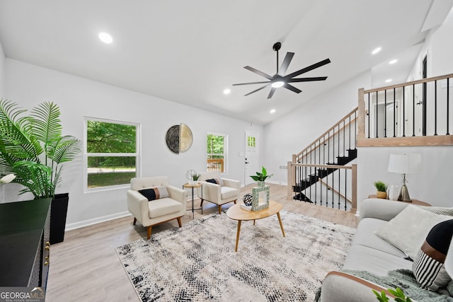 4058 Daron Ct, Ellenwood, GA 30294 - living area featuring lofted ceiling, wood finished floors, a ceiling fan, stairway, and recessed lighting