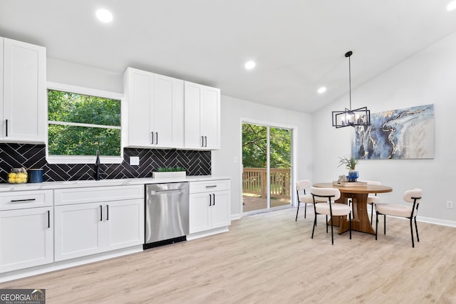 4058 Daron Ct, Ellenwood, GA 30294 - kitchen featuring stainless steel dishwasher, tasteful backsplash, white cabinets, lofted ceiling, and recessed lighting