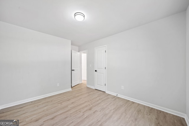 4058 Daron Ct, Ellenwood, GA 30294 - empty room with light wood-style flooring and baseboards