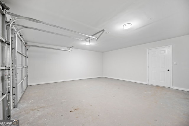 4058 Daron Ct, Ellenwood, GA 30294 - garage featuring baseboards