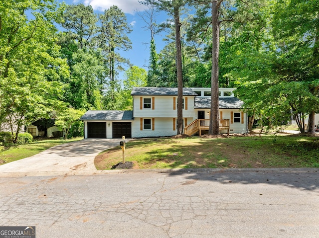 4058 Daron Ct, Ellenwood, GA 30294 - tri-level home with a garage, driveway, and a front yard