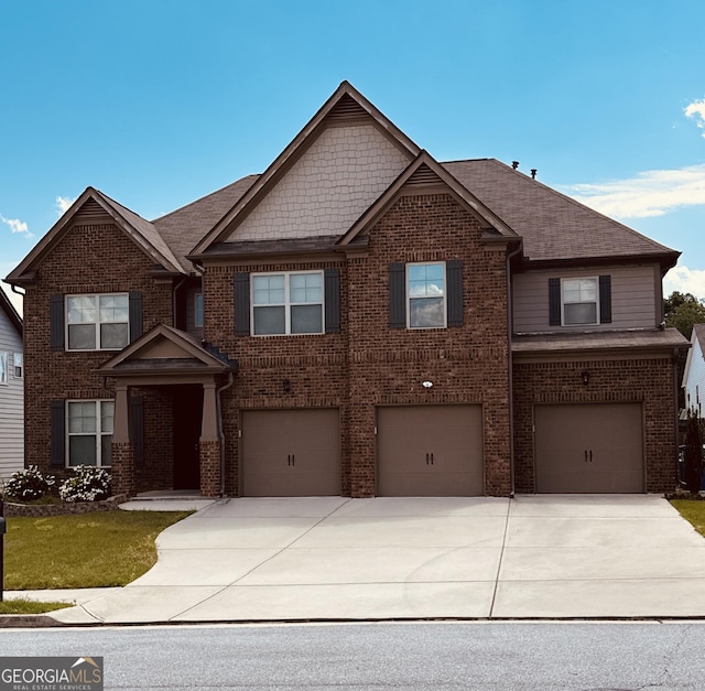 419 Woodmill Way SW, South Fulton, GA 30331 - view of front facade with brick siding, driveway, a garage, and a shingled roof