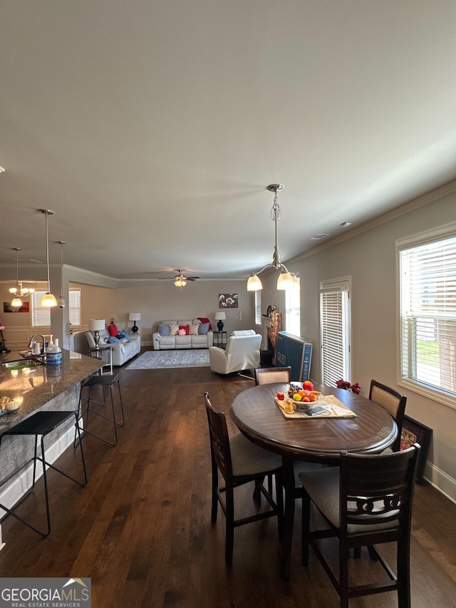 419 Woodmill Way SW, South Fulton, GA 30331 - dining room with ornamental molding, dark wood-style floors, plenty of natural light, a ceiling fan, and baseboards